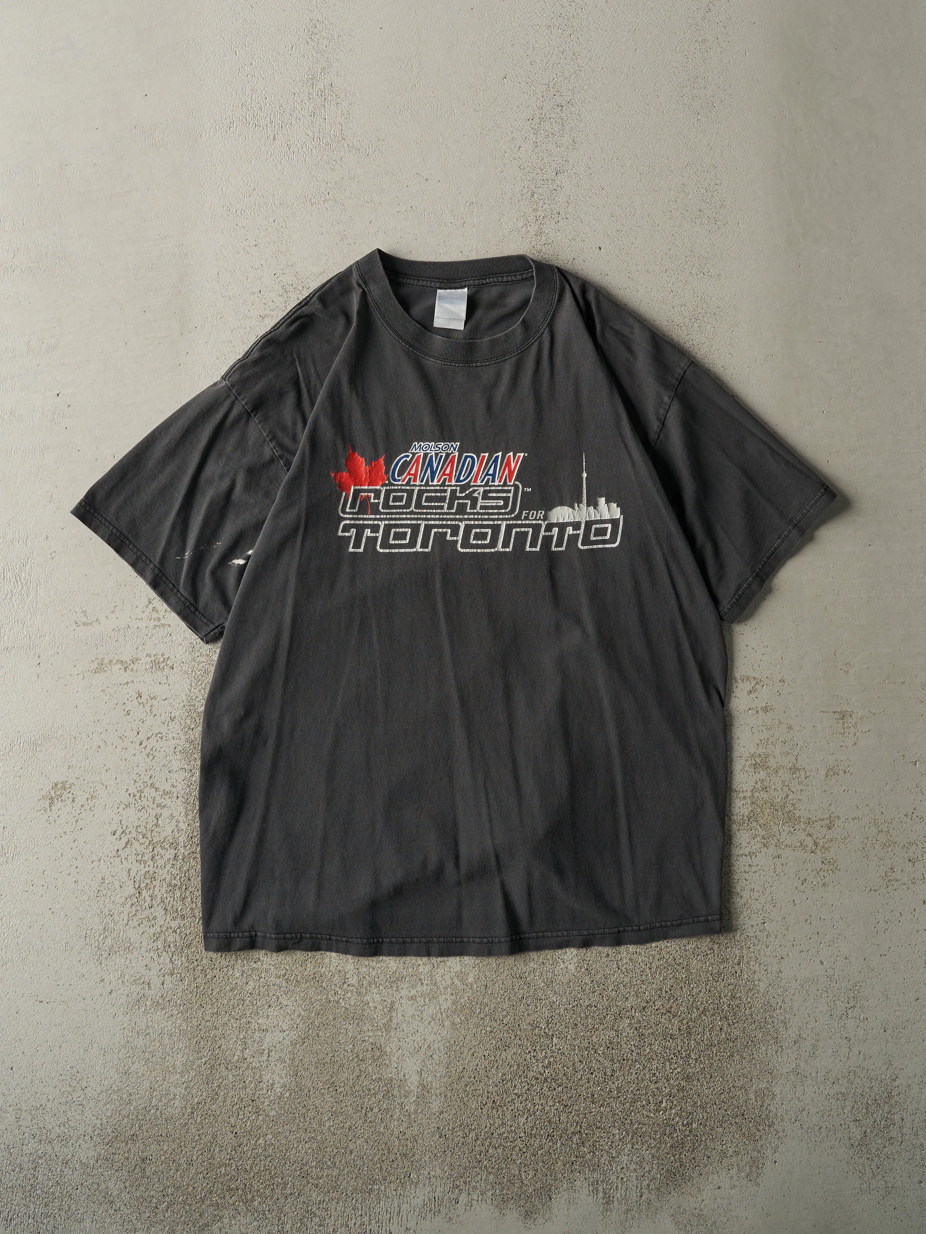 Vintage 03' Faded Black Molson Canadian Rocks Toronto Tee (L) sold by Rebalance Vintage