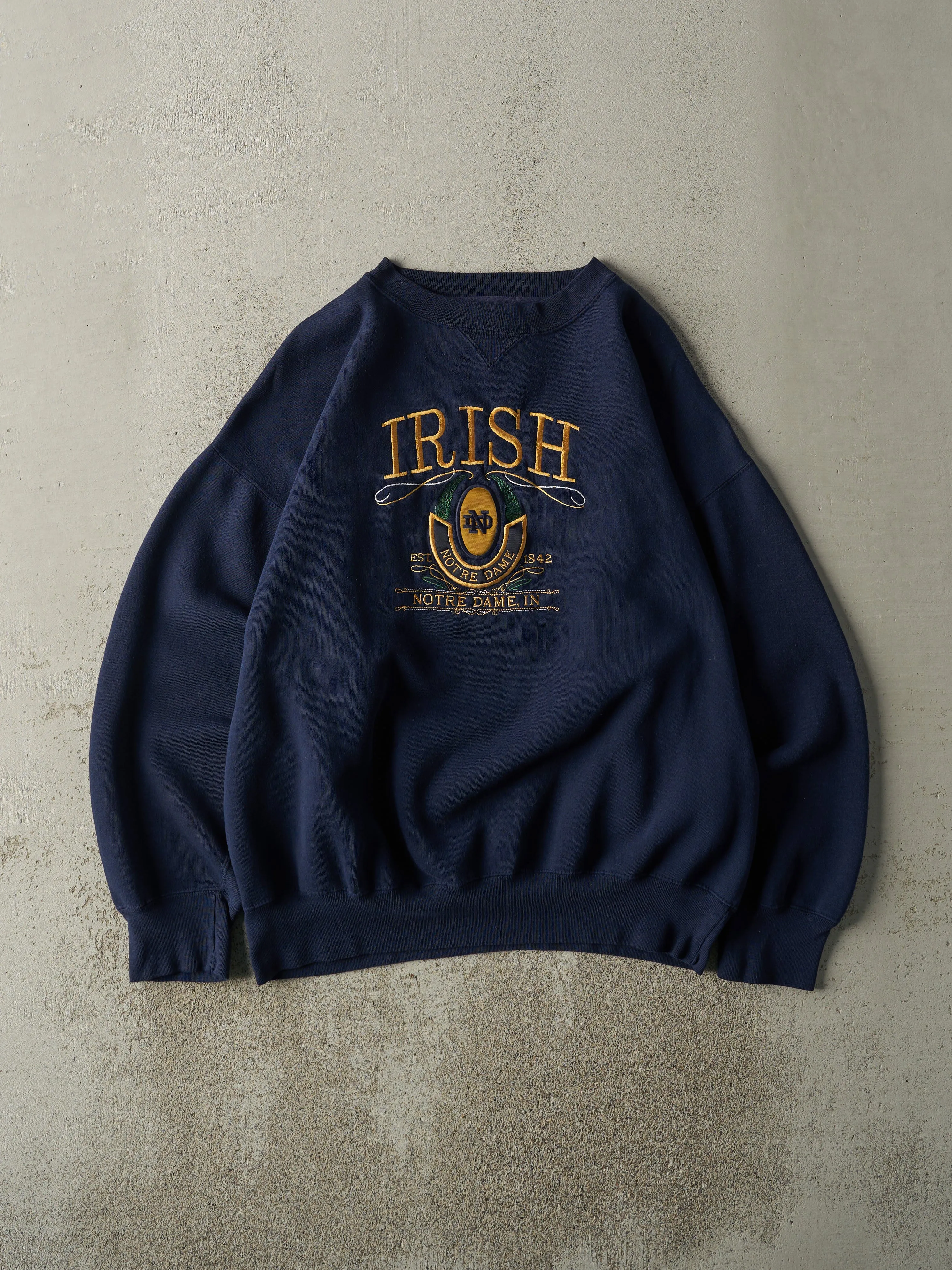 Vintage 90s Navy Blue Notre Dame Fighting Irish Crewneck (L/XL) sold by Rebalance Vintage