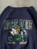 Vintage 80s Navy Blue Notre Dame Fighting Irish Crewneck (S/M) sold by Rebalance Vintage