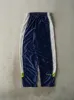 Vintage 90s Navy Blue Nike Tear Away Track Pants (29x34) sold by Rebalance Vintage