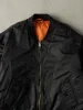 Vintage 90s Black & Orange Reversible Bomber Flight Jacket (XL) sold by Rebalance Vintage