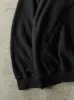Vintage 90s Black Embroidered Wilson Boxy Hoodie (XXL) sold by Rebalance Vintage
