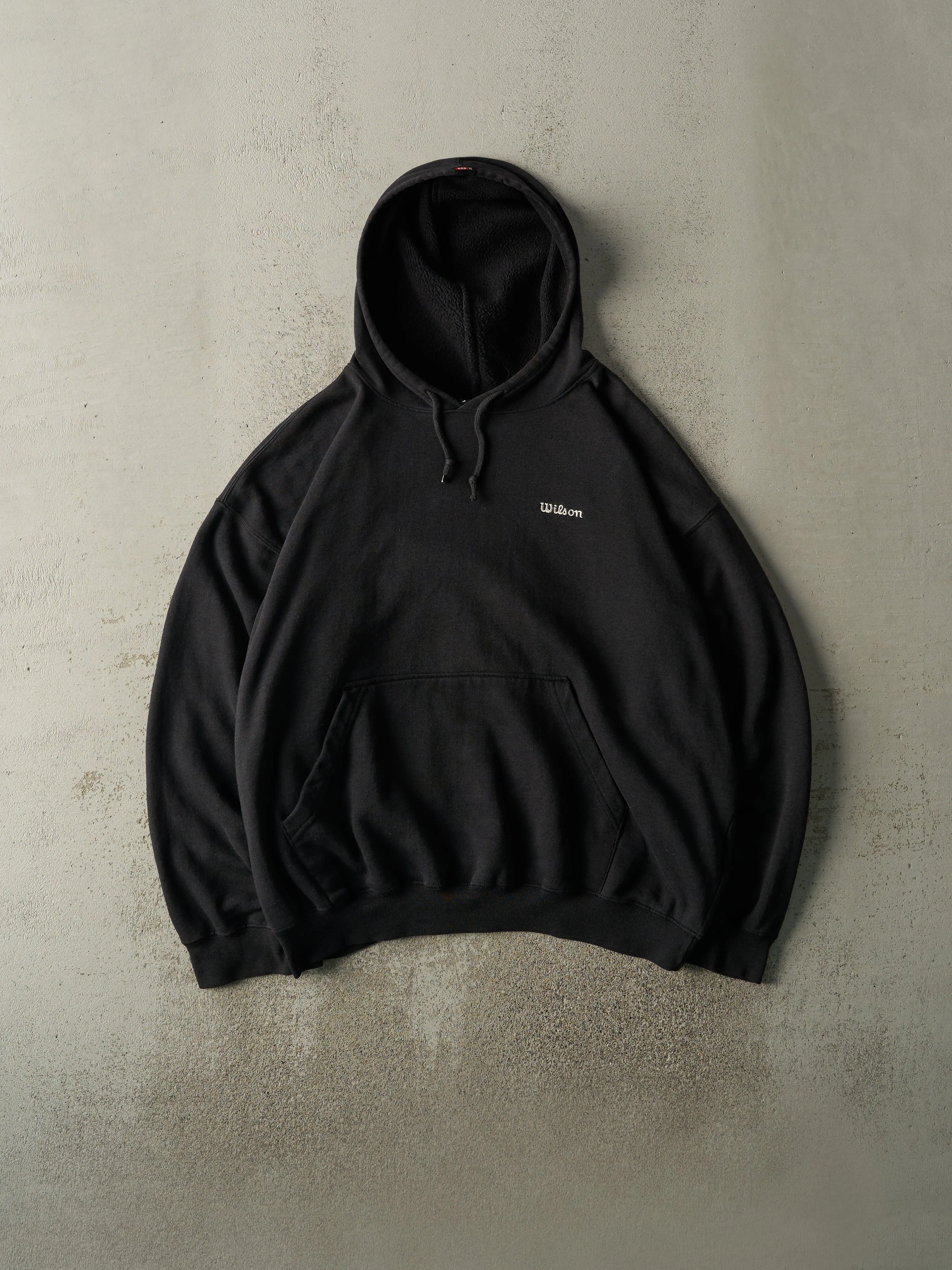 Vintage 90s Black Embroidered Wilson Boxy Hoodie (XXL) sold by Rebalance Vintage