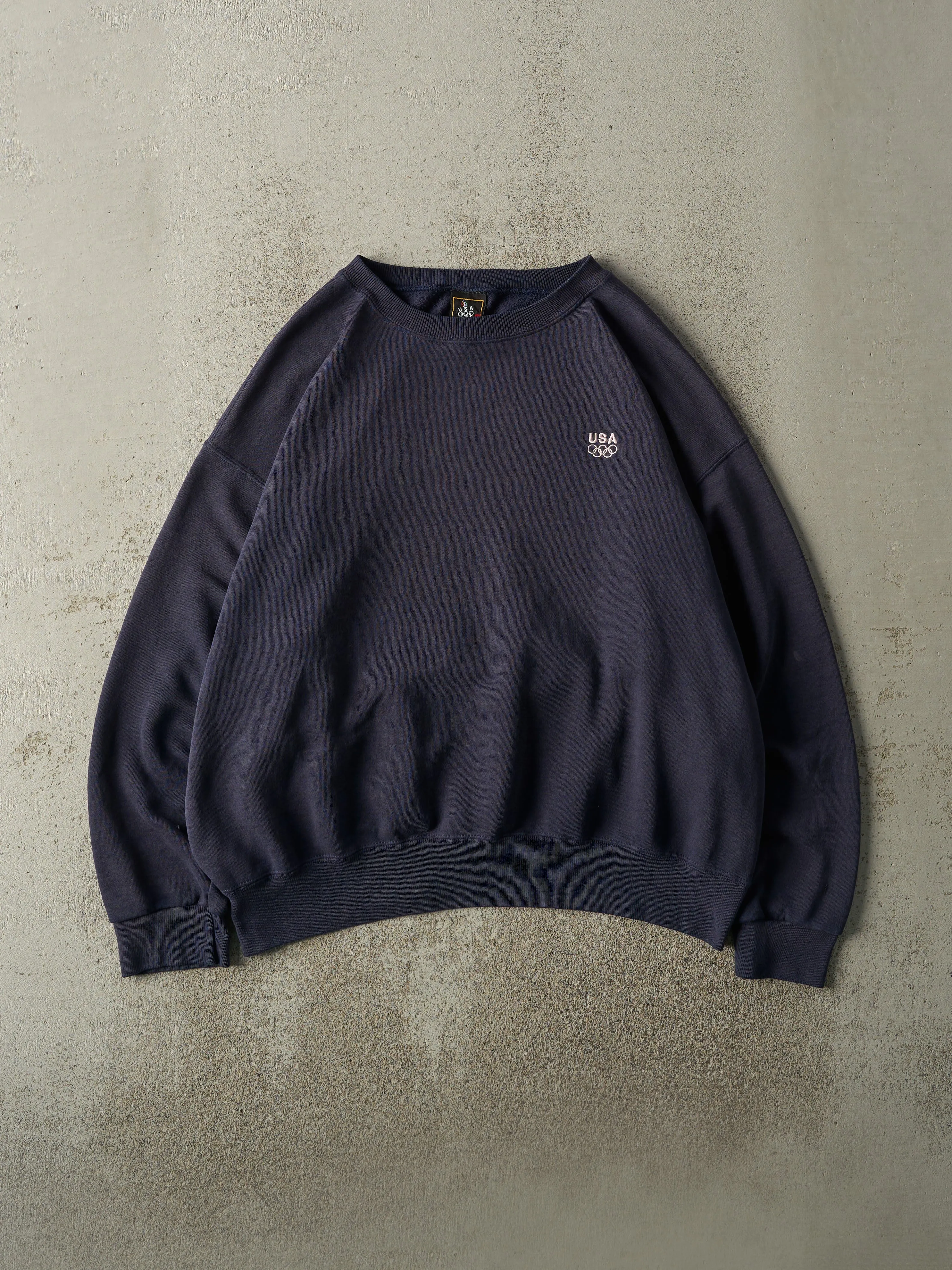 Vintage 90s Navy Blue Embroidered USA Olympics Boxy Crewneck (L) sold by Rebalance Vintage