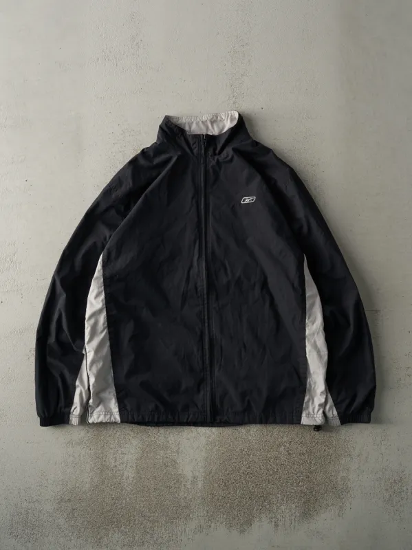 Vintage Y2K Black & Grey Embroidered Reebok Windbreaker Jacket (M) sold by Rebalance Vintage