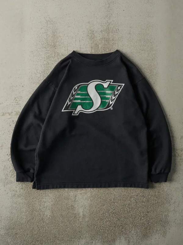 Vintage 90s Black Saskatchewan Roughriders CFL Crewneck (S/M) sold by Rebalance Vintage