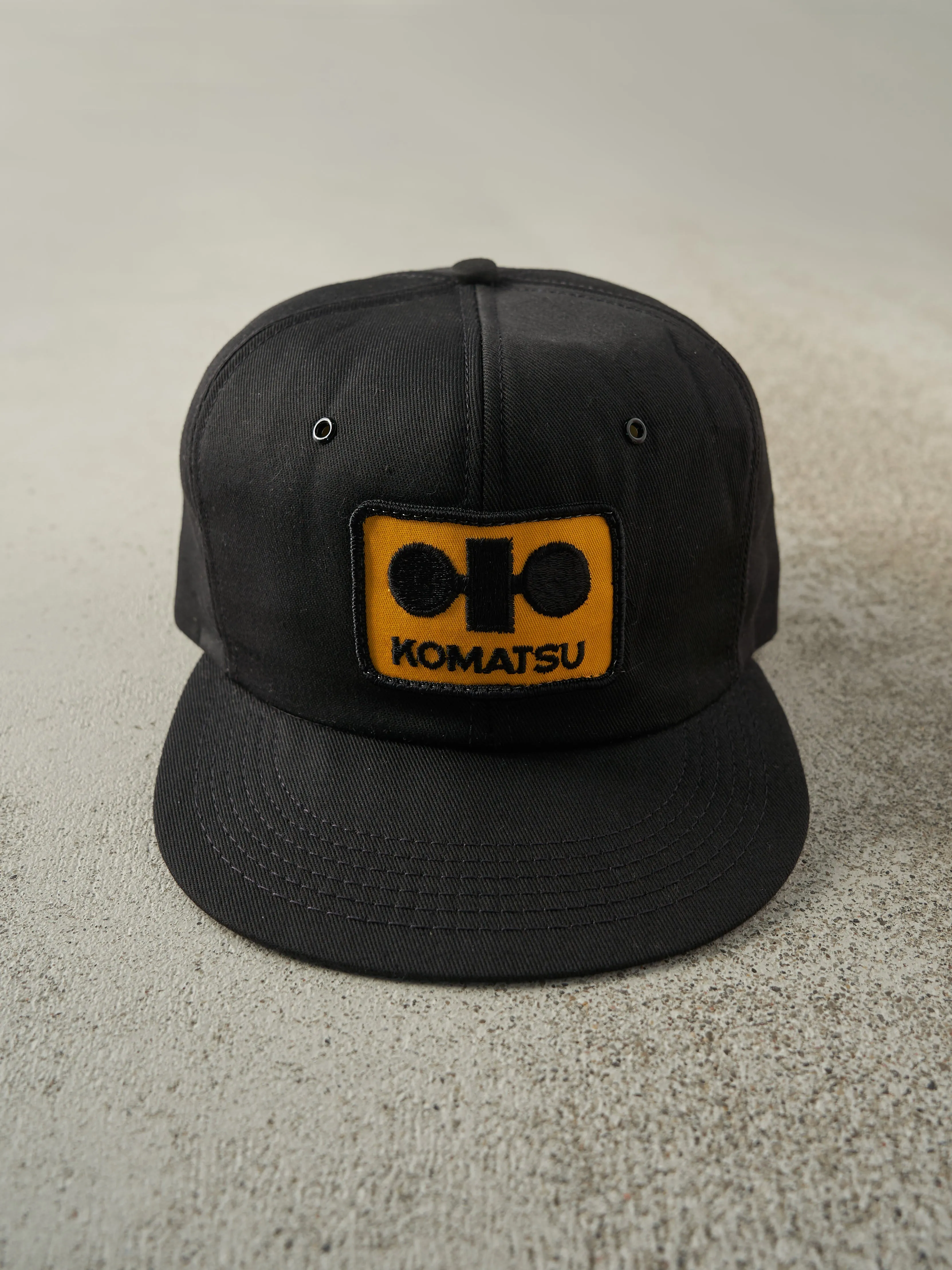 Vintage 90s Black Komatsu Foam Snapback Hat sold by Rebalance Vintage