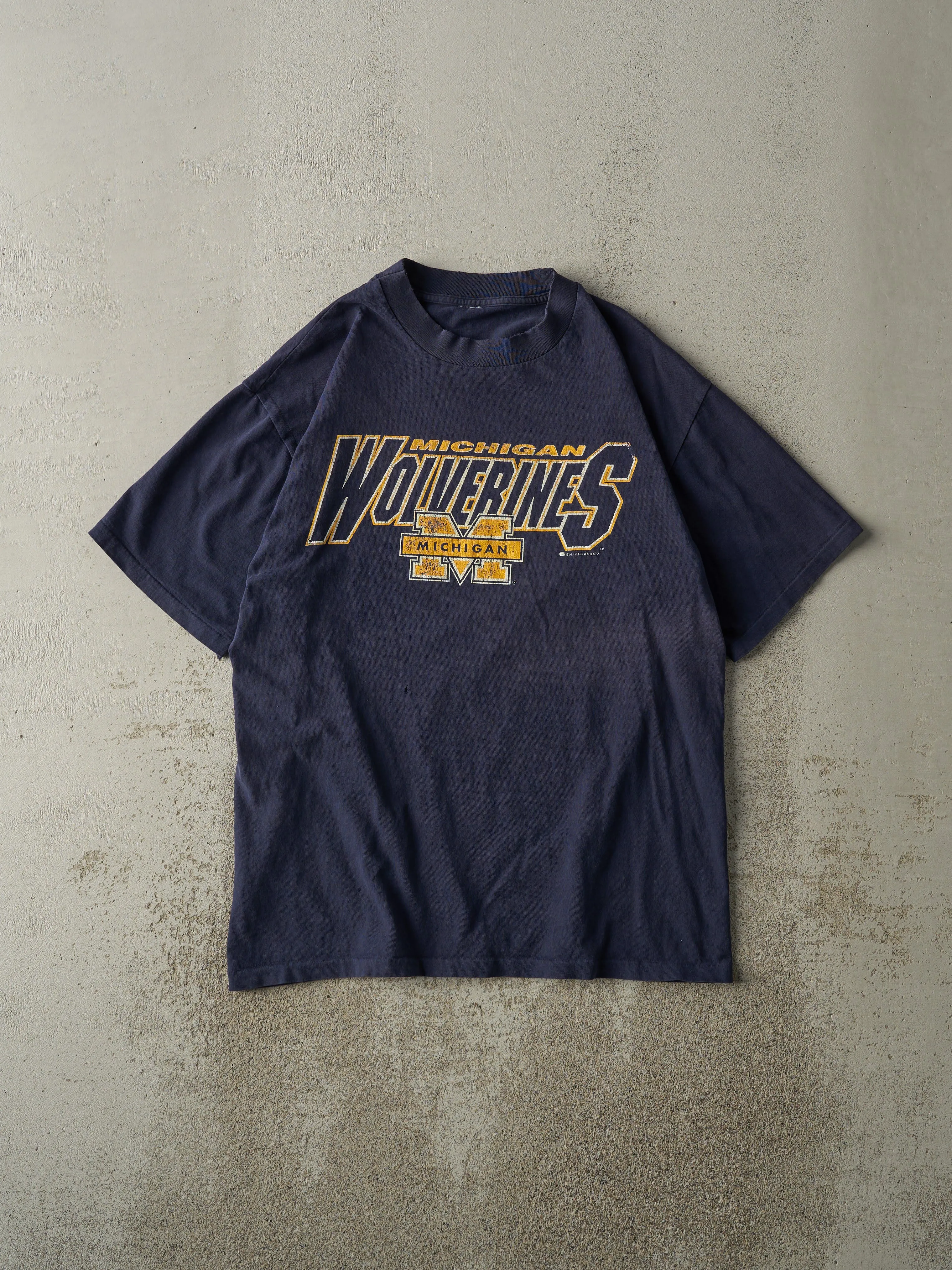 Vintage 90s Navy Blue Michigan Wolverines Single Stitch Tee (M) sold by Rebalance Vintage