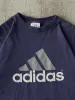 Vintage 90s Navy Blue Adidas Logo Tee (XL) sold by Rebalance Vintage