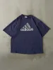 Vintage 90s Navy Blue Adidas Logo Tee (XL) sold by Rebalance Vintage