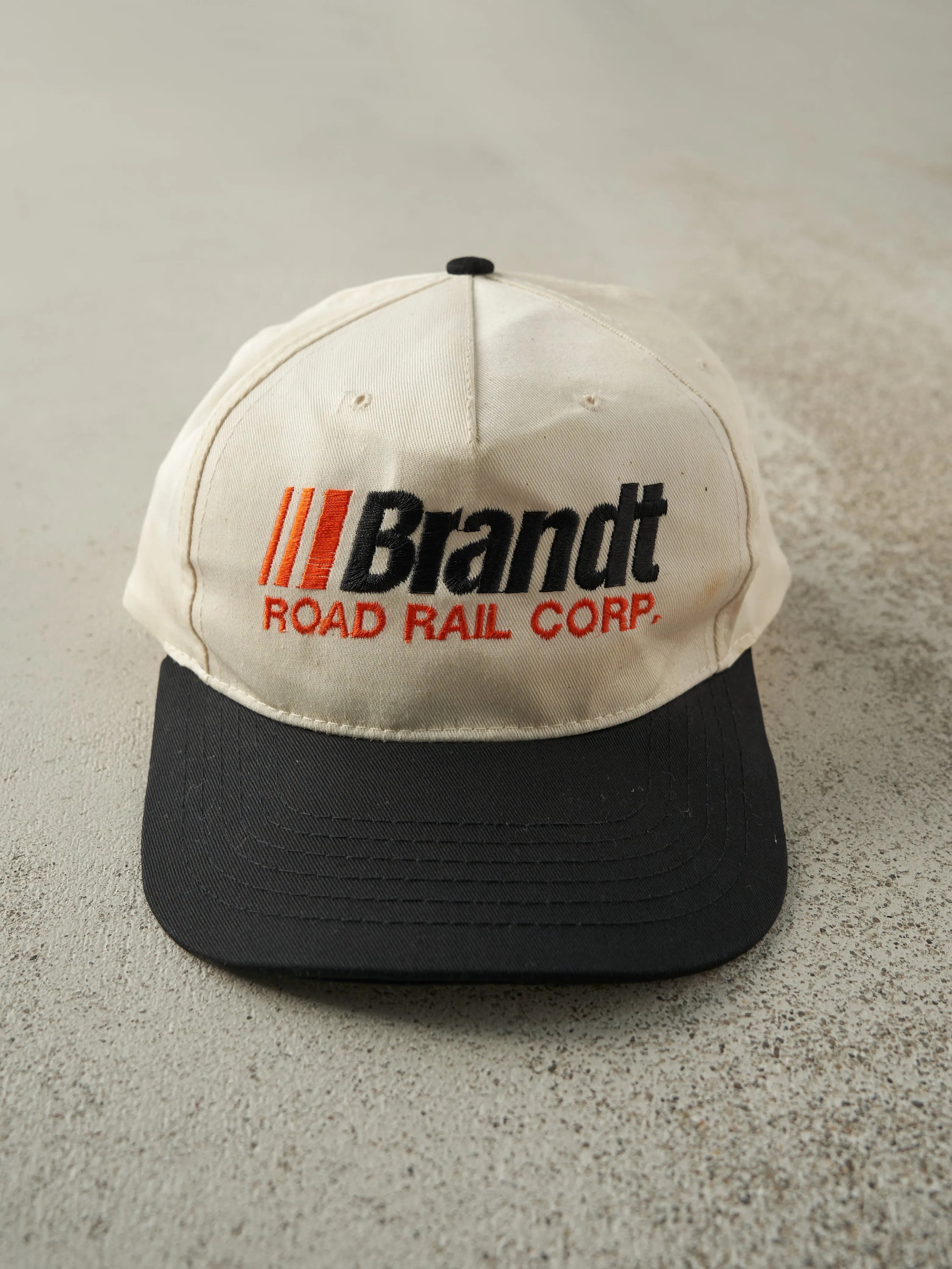Vintage 90s White & Black Embroidered Brandt Two Tone Snapback sold by Rebalance Vintage