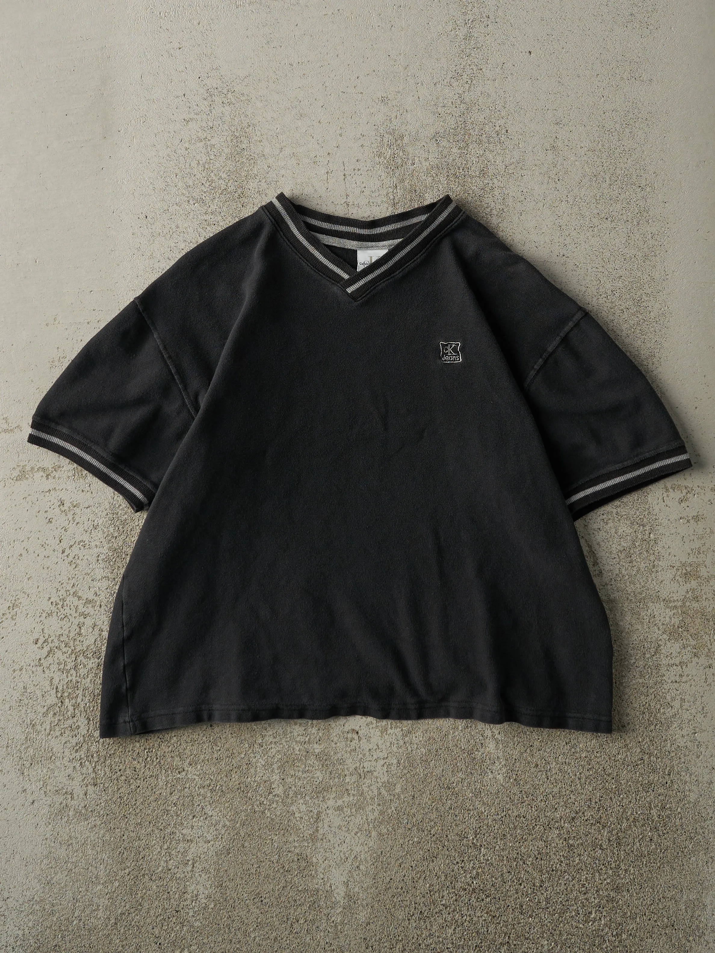 Vintage 90s Faded Black Calvin Klein Jeans Embroidered Boxy Shirt (S/M) sold by Rebalance Vintage