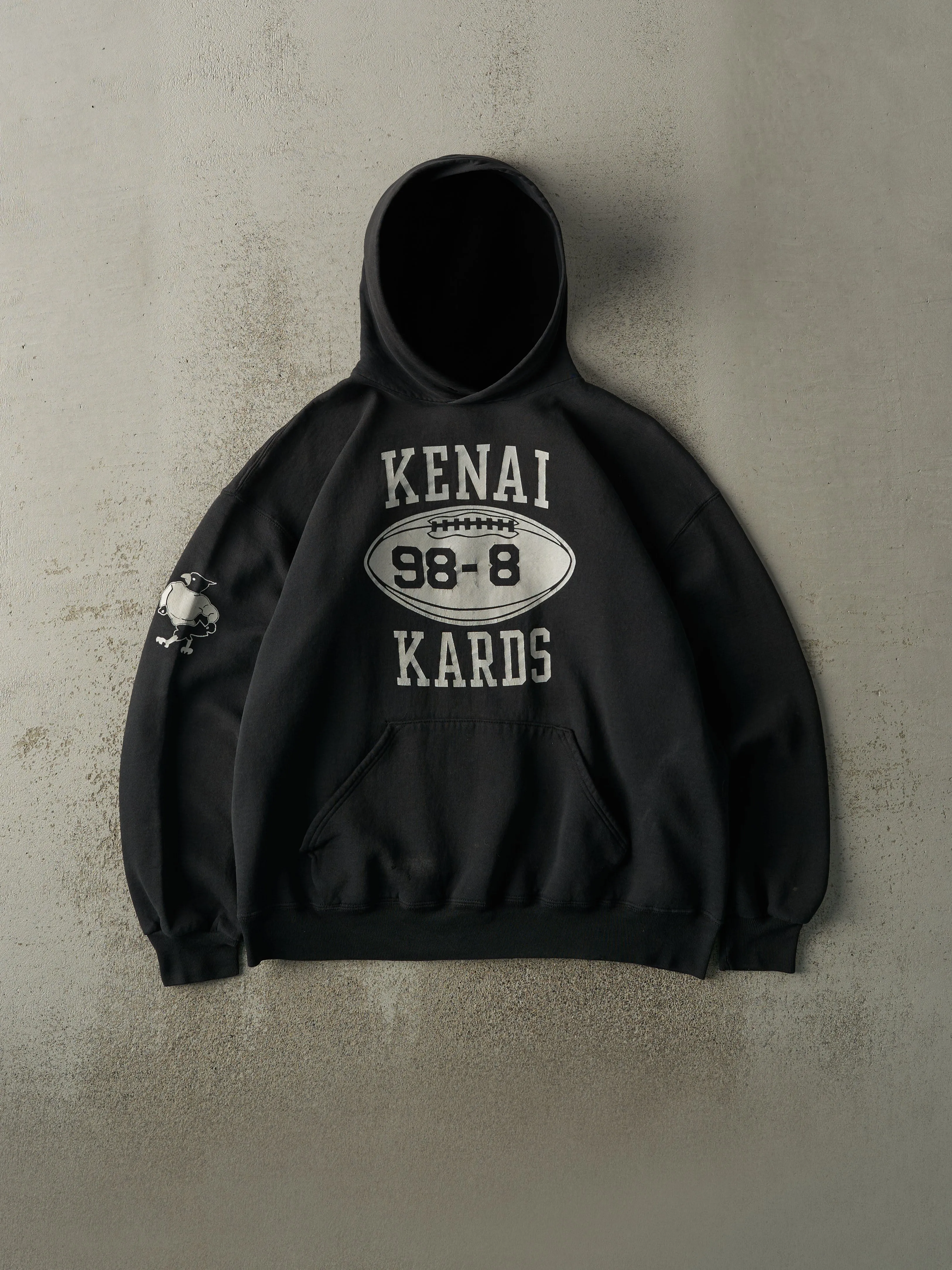 Vintage 90s Black Kenai Kards Football Russell Athletic Hoodie (L/XL) sold by Rebalance Vintage