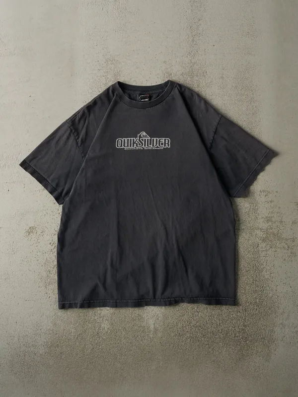 Vintage Y2K Faded Black Quiksilver Boarding Development Logo Tee (L/XL) sold by Rebalance Vintage