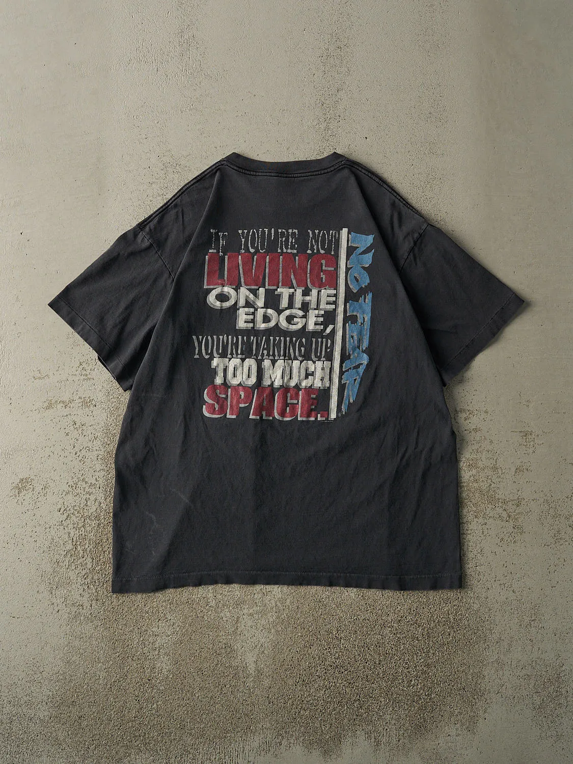 Vintage 95' Faded Black No Fear "Living on the Edge" Single Stitch Tee (L/XL) sold by Rebalance Vintage