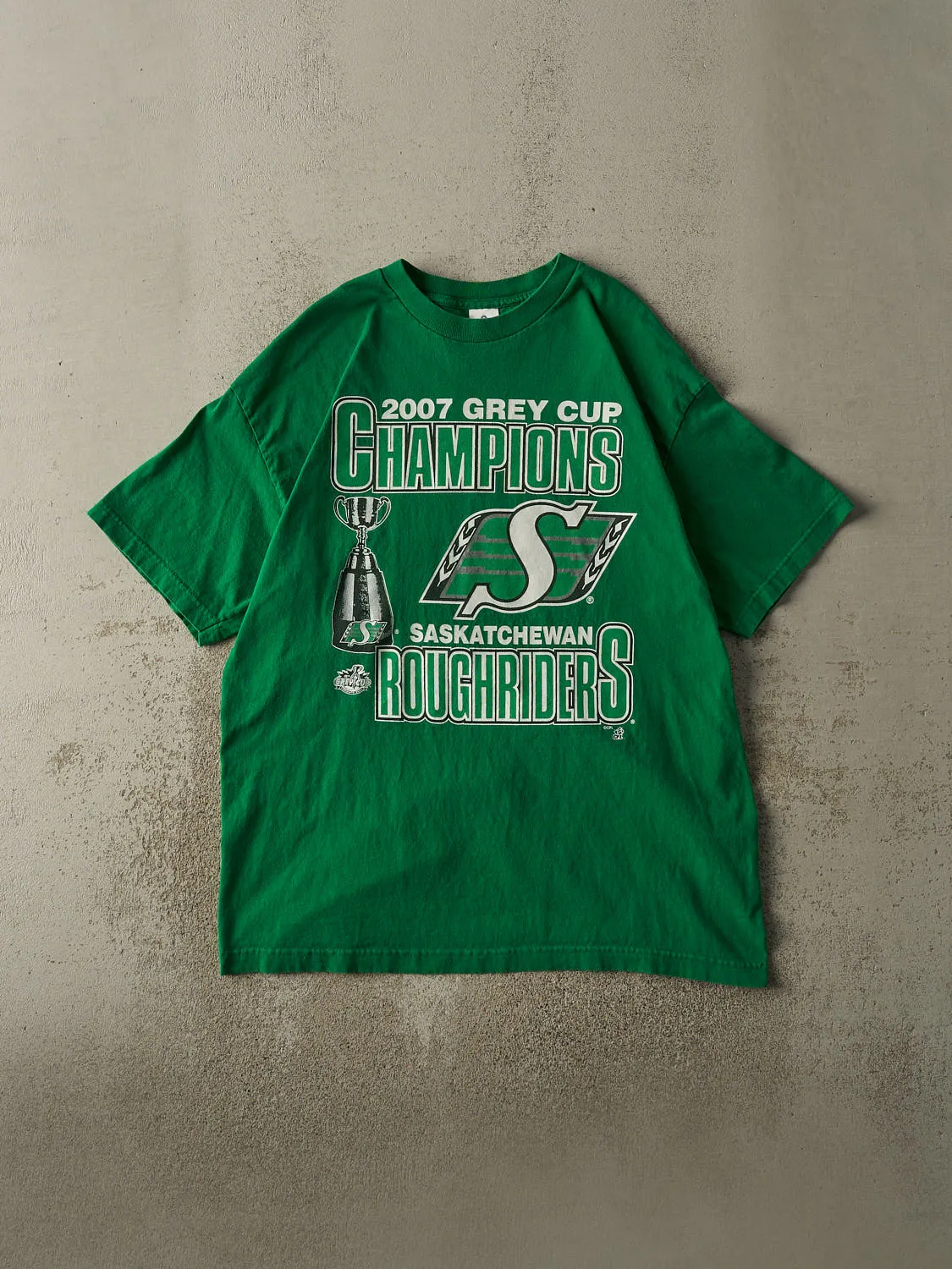 Vintage 07' Green Saskatchewan Rough Riders Grey Cup Champions Tee (XL) sold by Rebalance Vintage
