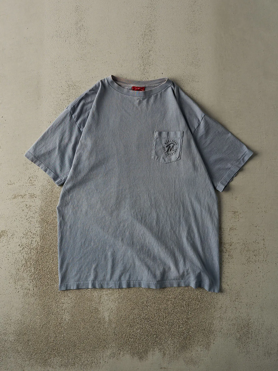 Vintage 90s Washed Blue Marlboro Country Store Pocket Tee (XL/XXL) sold by Rebalance Vintage