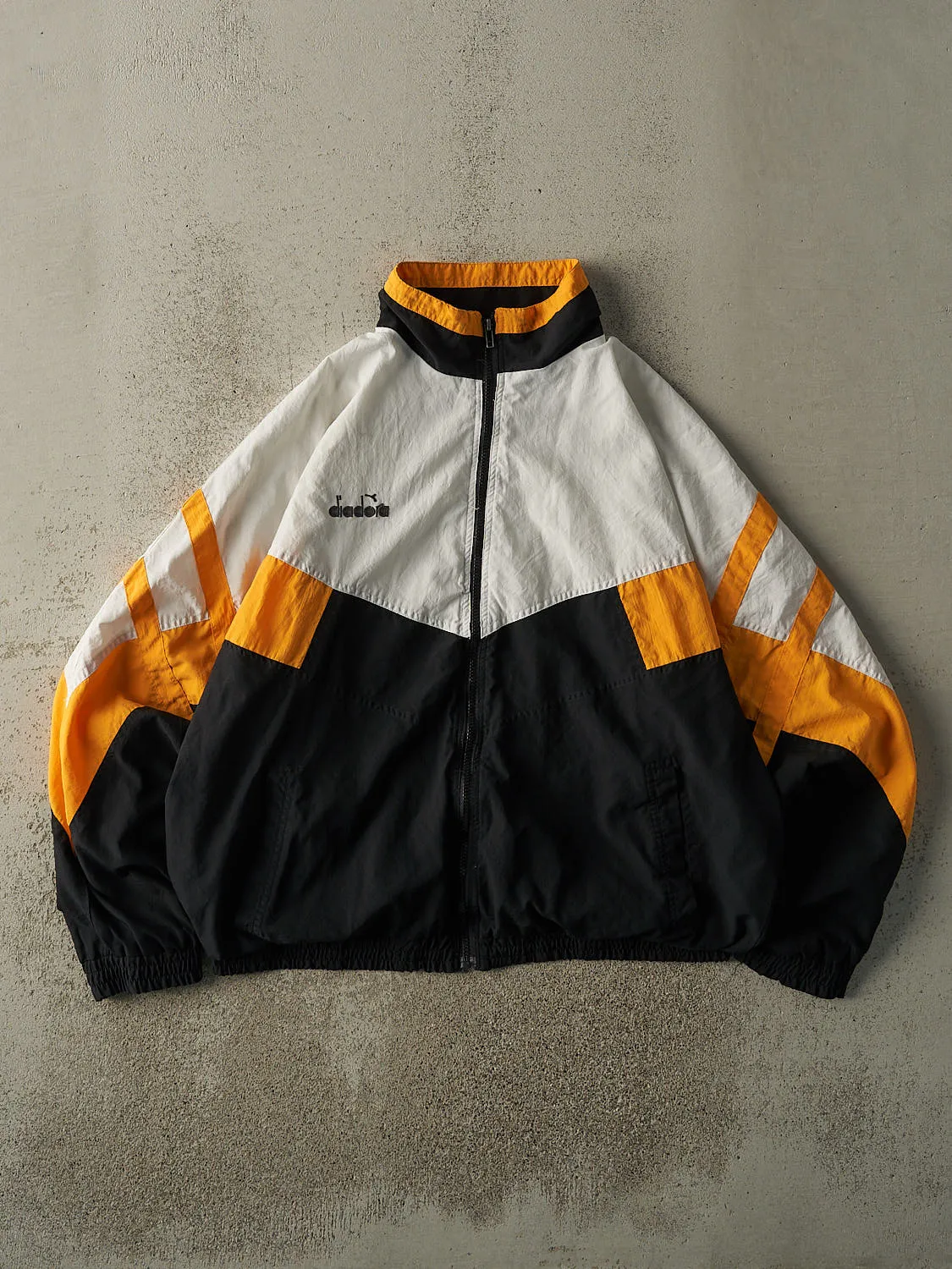 Vintage 90s White, Black & Yellow Diadora Boxy Track Jacket (XL) sold by Rebalance Vintage
