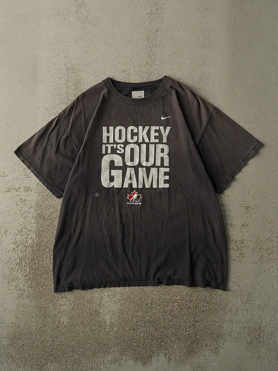 Vintage Y2K Faded Black "Hockey It's Our Game" Team Canada Nike Tee (L/XL) sold by Rebalance Vintage