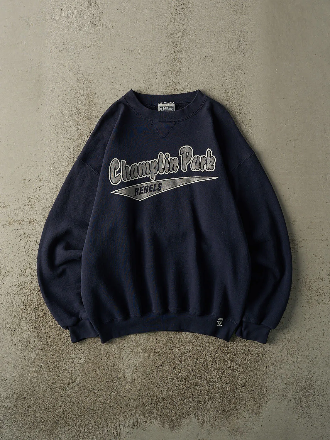 Vintage 90s Navy Blue Champlin Park Rebels Crewneck (L/XL) sold by Rebalance Vintage