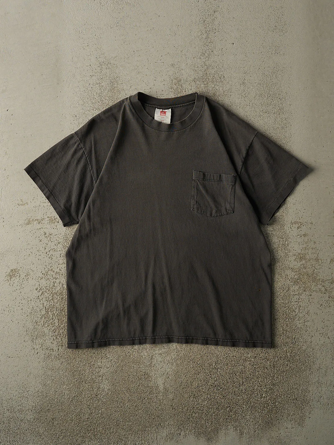 Vintage 90s Faded Black Blank Pocket Tee (M) sold by Rebalance Vintage