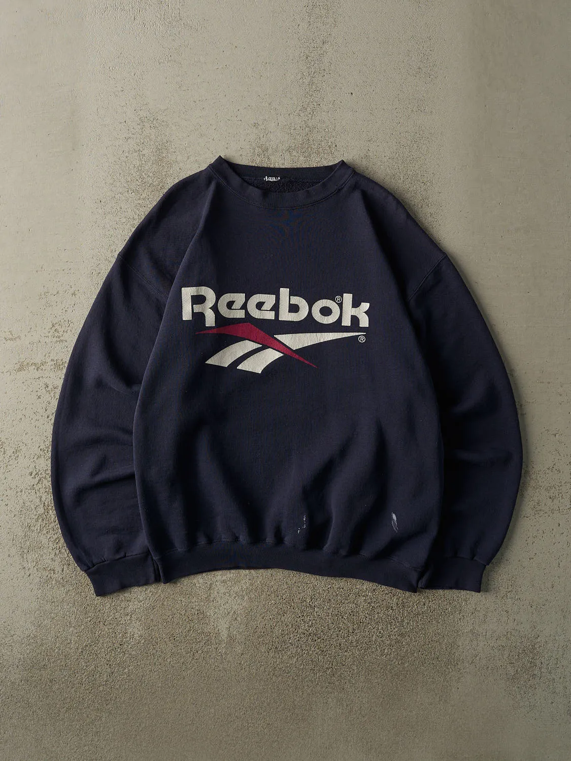 Vintage 90s Navy Blue Reebok Logo Crewneck (L) sold by Rebalance Vintage