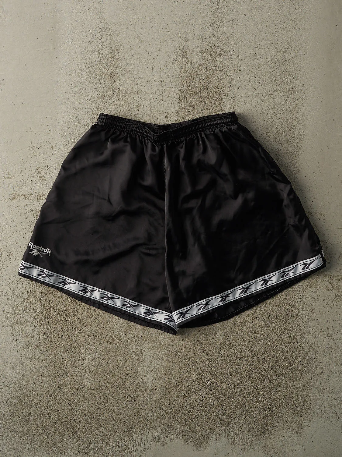 Vintage 90s Black Reebok Track Shorts (28x7) sold by Rebalance Vintage