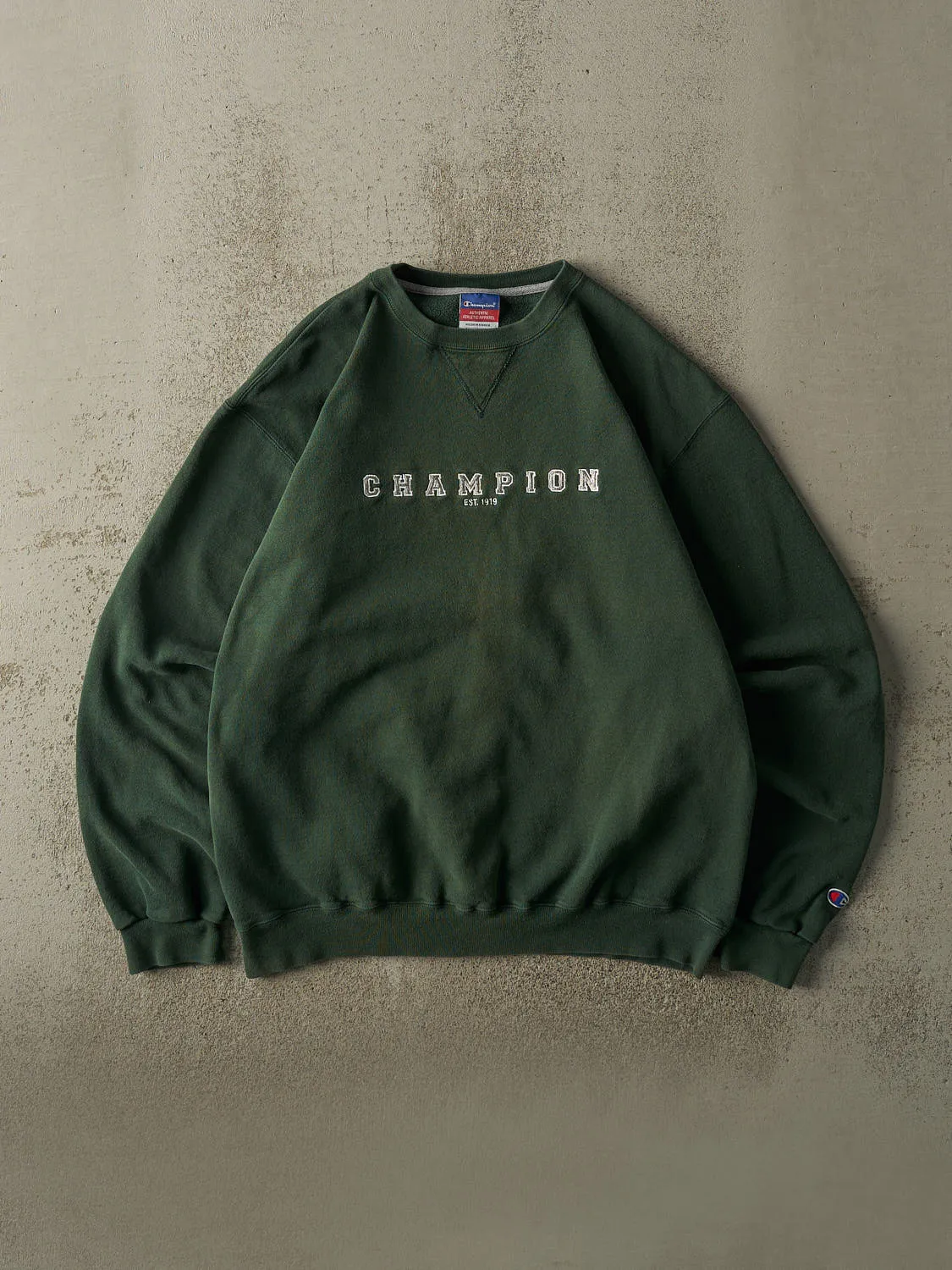 Vintage 90s Sun Faded Green Champion Embroidered Crewneck (L/XL) sold by Rebalance Vintage