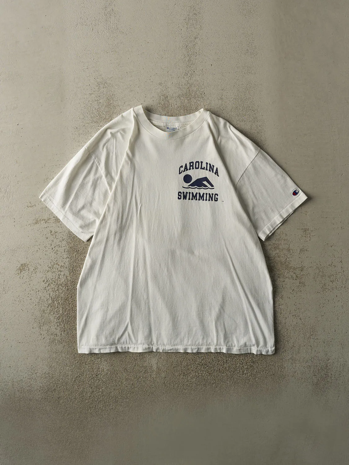 Vintage 90s White University of North Carolina Swimming Single Stitch Tee (L/XL) sold by Rebalance Vintage