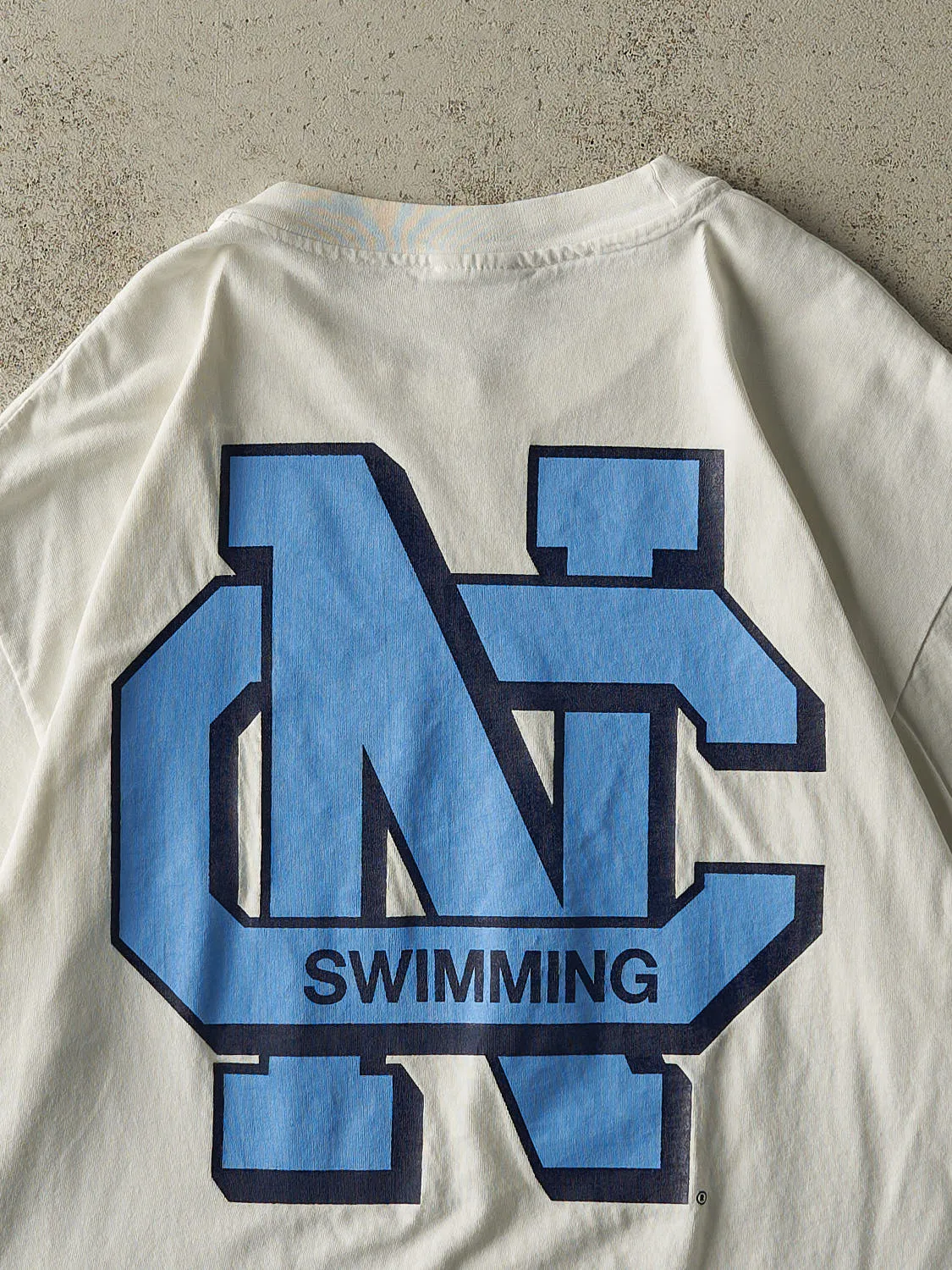 Vintage 90s White University of North Carolina Swimming Single Stitch Tee (L/XL) sold by Rebalance Vintage product image thumbnail 5