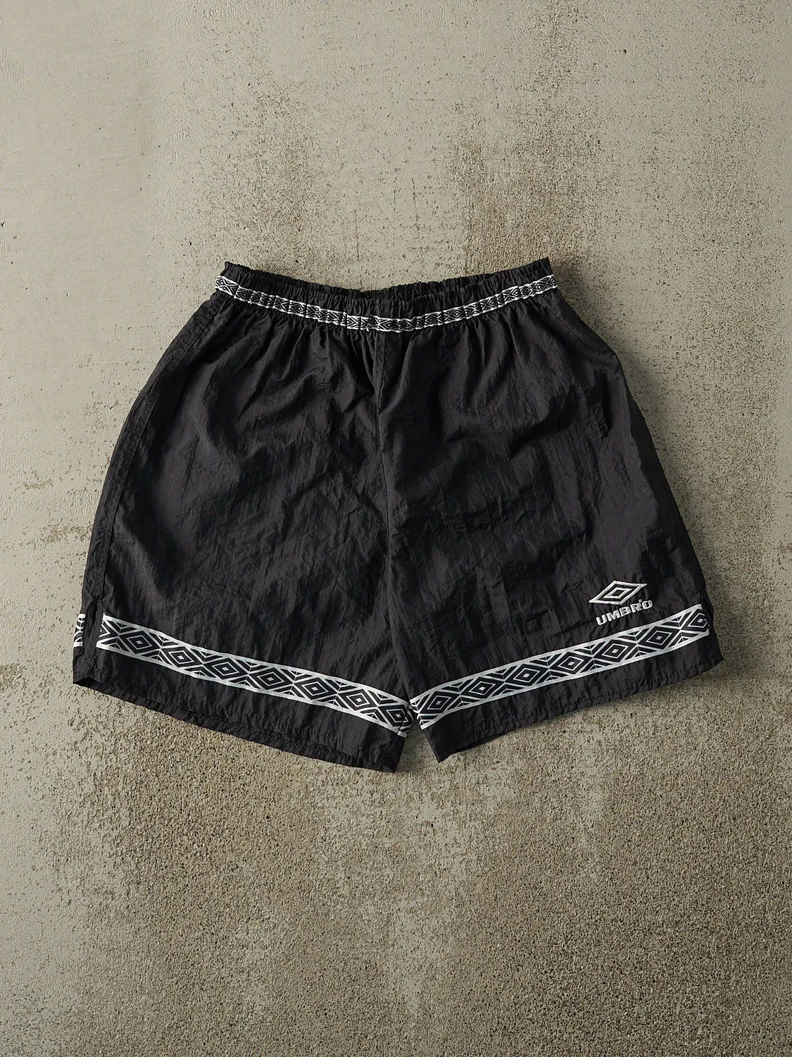 Vintage 90s Black Umbro Nylon Track Shorts (27x6) sold by Rebalance Vintage