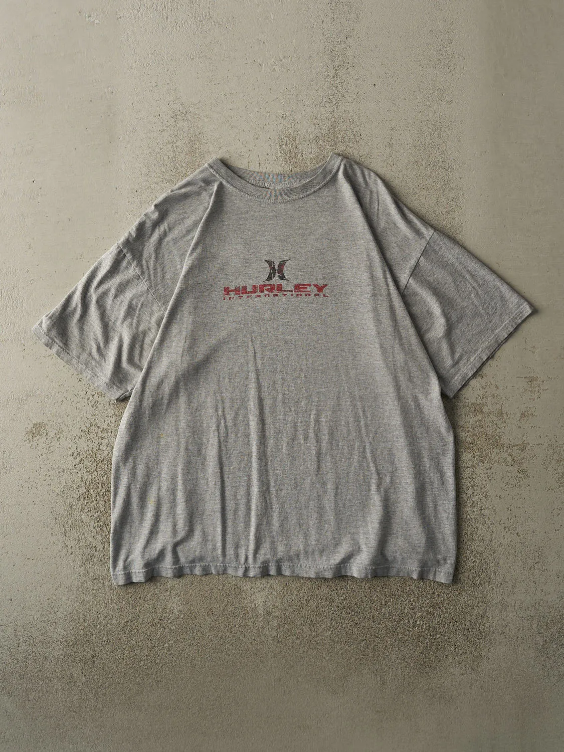 Vintage Y2K Grey Hurley Logo Tee (XL) sold by Rebalance Vintage