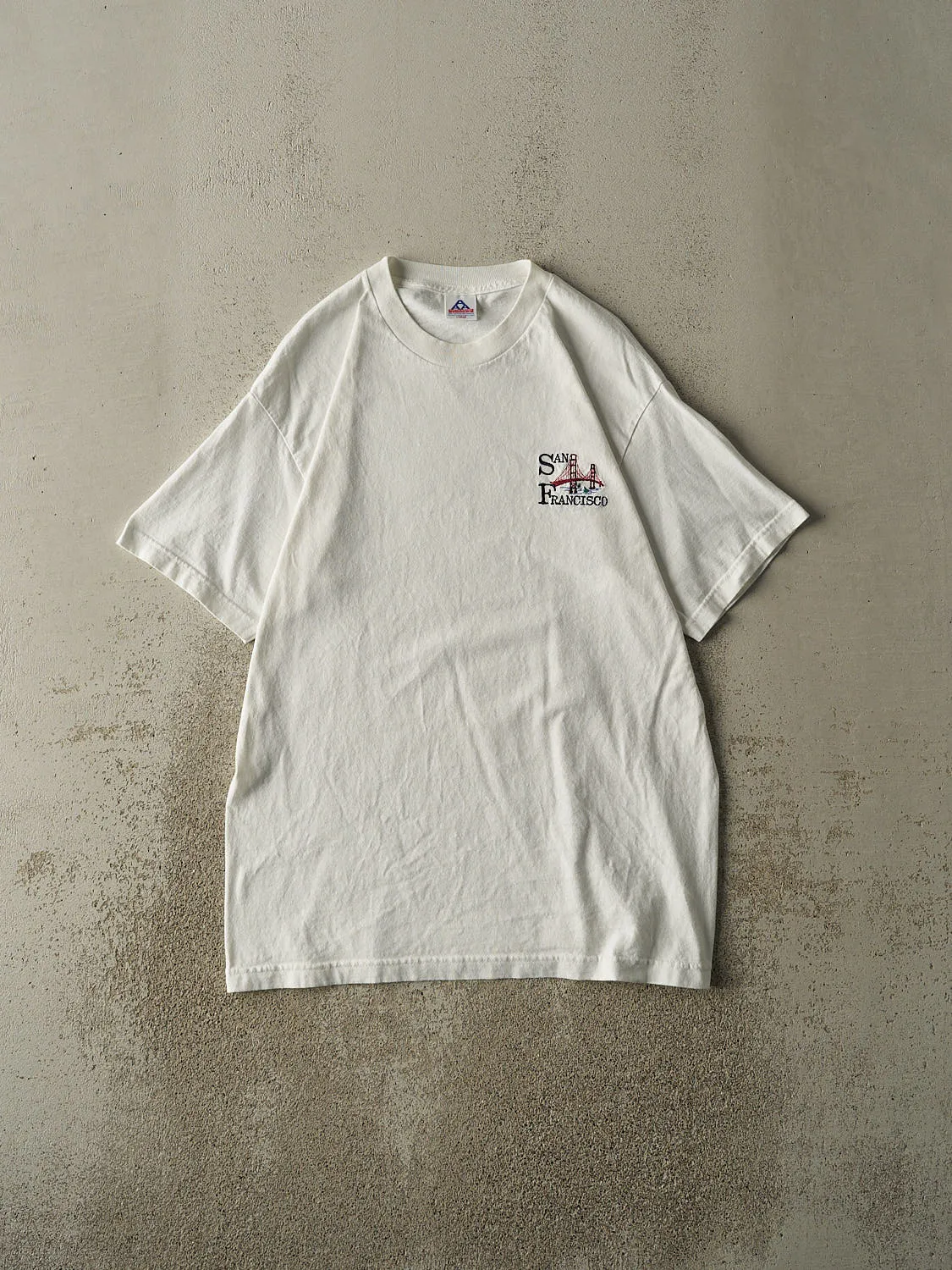 Vintage 90s White San Francisco Embroidered Tee (L/XL) sold by Rebalance Vintage