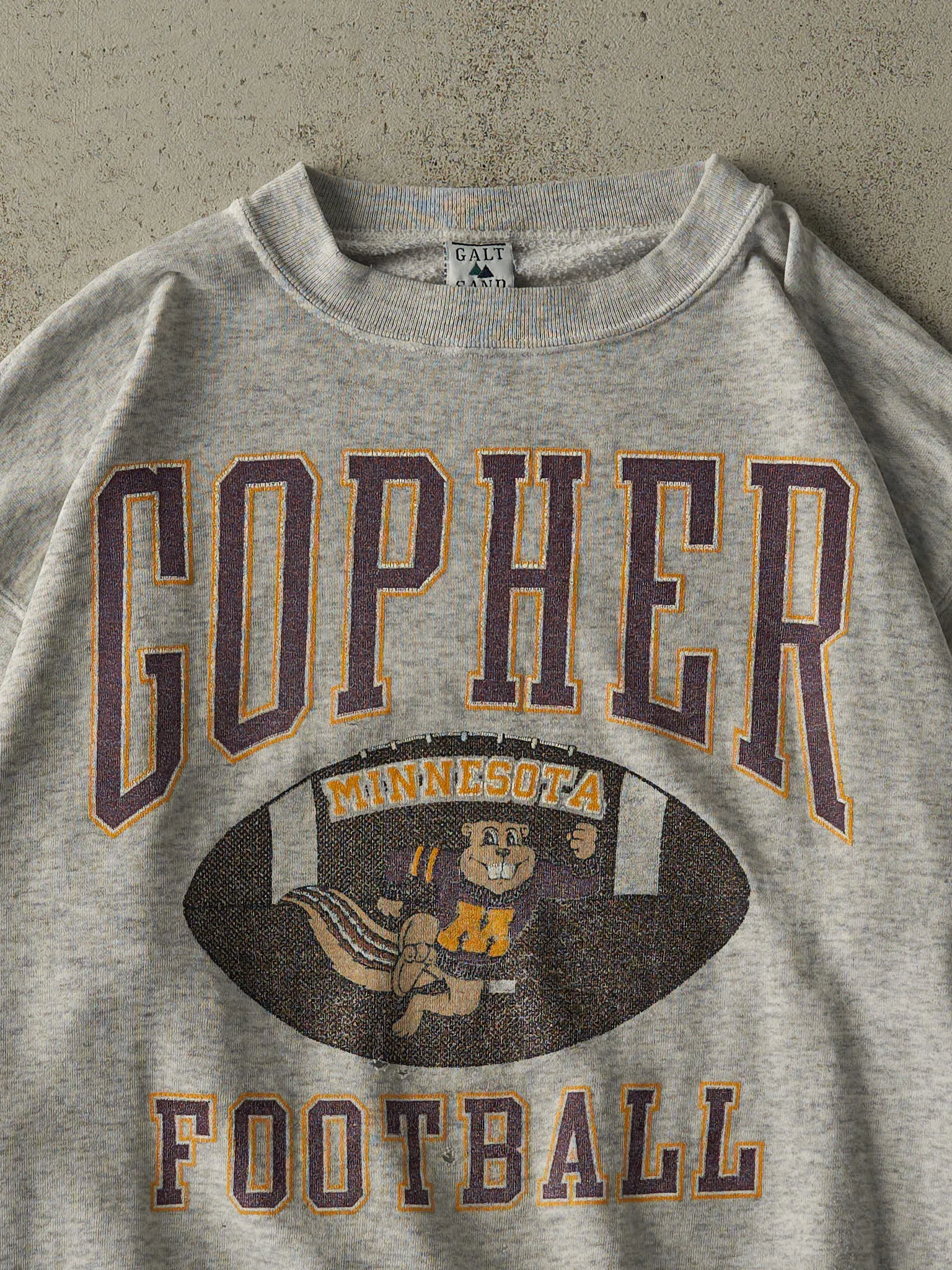 Vintage 90s Heather Grey University of Minnesota Gopher Football Crewneck (L/XL) sold by Rebalance Vintage product image thumbnail 2