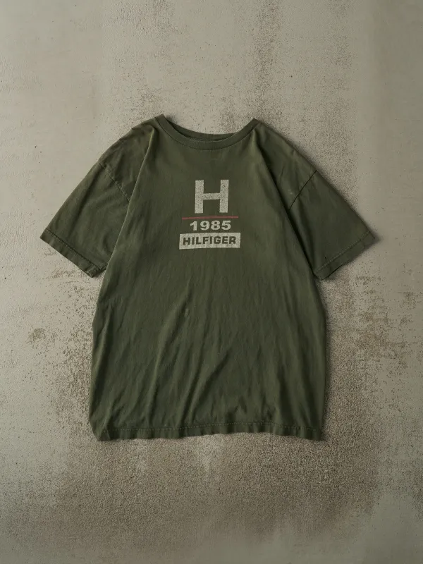 Vintage 90s Sun Faded Green Tommy Hilfiger Tee (L) sold by Rebalance Vintage