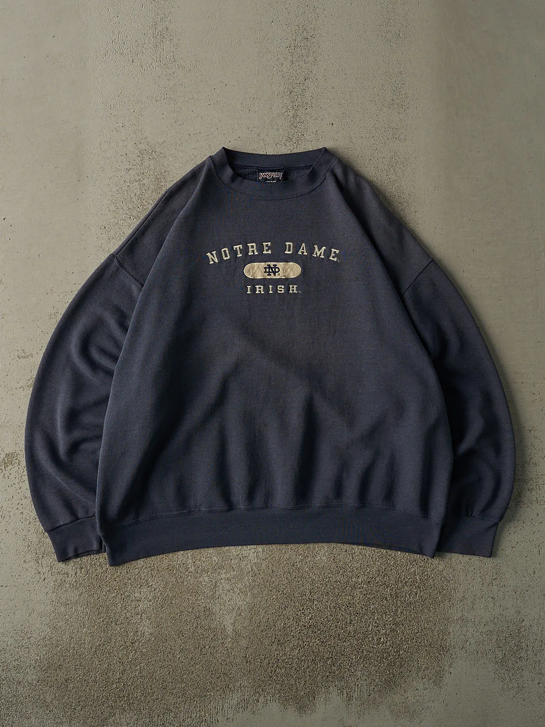 Vintage 90s Faded Navy University of Notre Dame Fighting Irish Embroidered Crewneck (XXL) sold by Rebalance Vintage