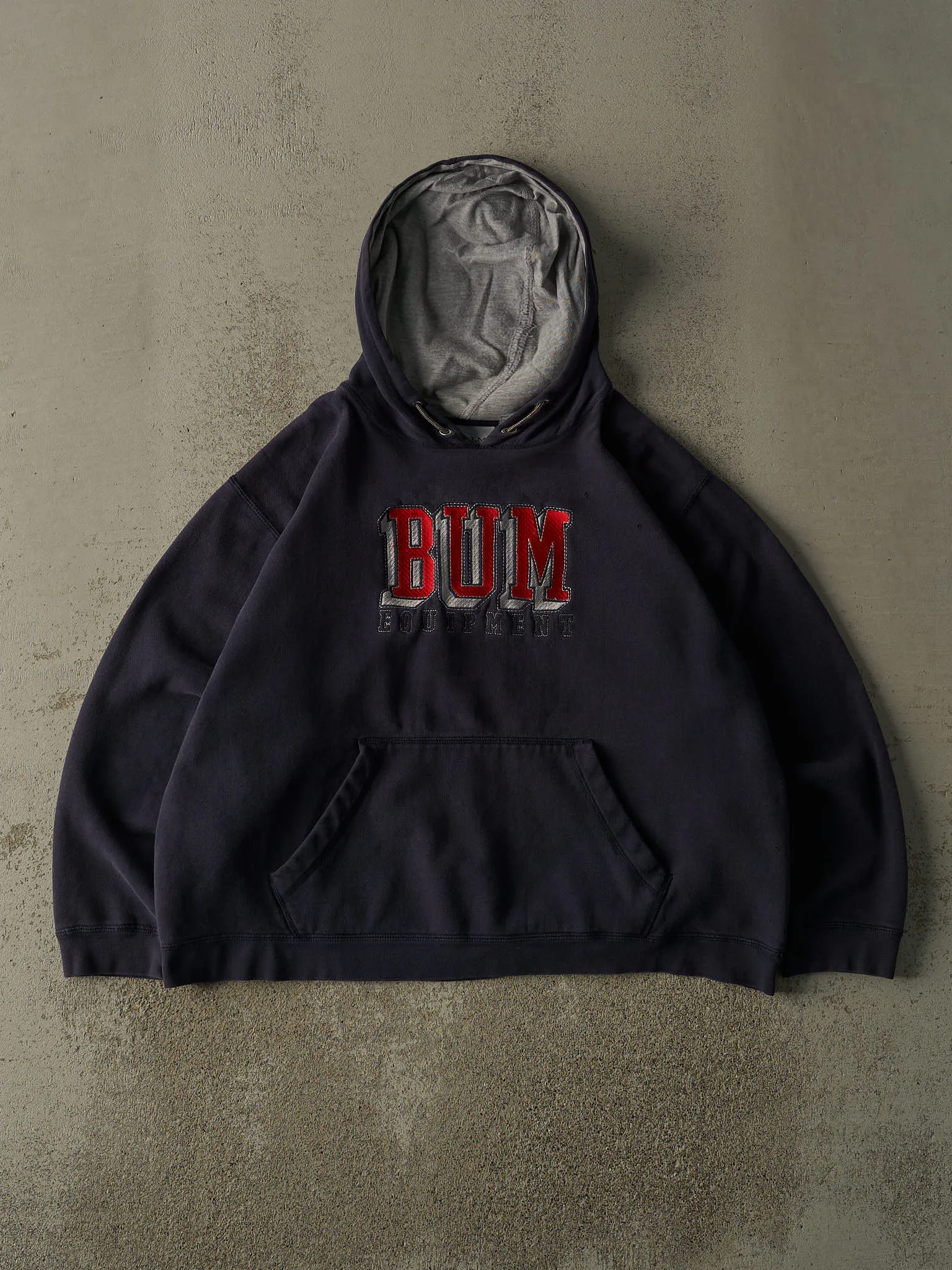Vintage 90s Navy Blue Bum Equipment Embroidered Boxy Hoodie (L/XL) sold by Rebalance Vintage