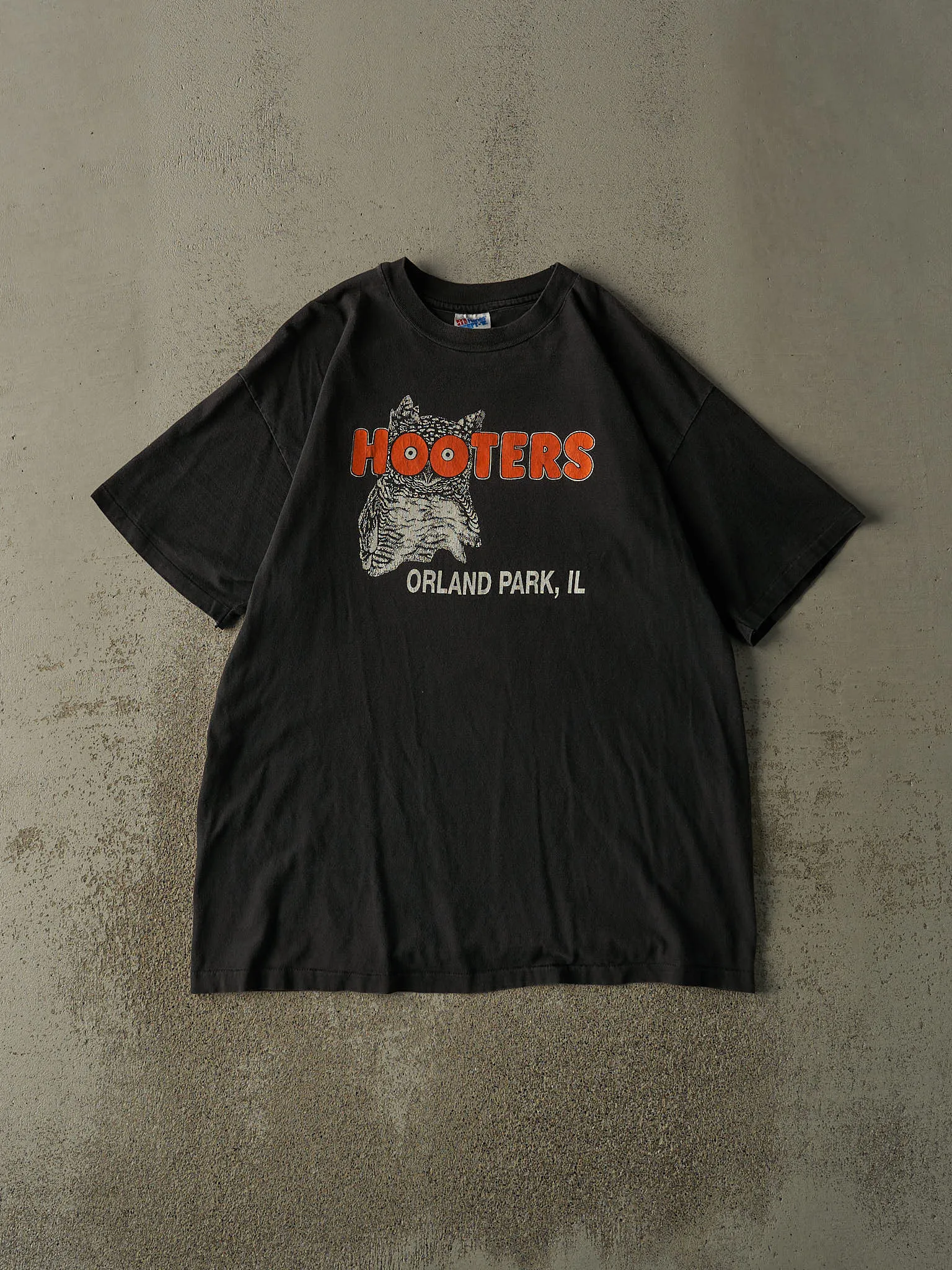 Vintage 90s Faded Black Hooters Orland Park, Il Single Stitch Tee (XL) sold by Rebalance Vintage