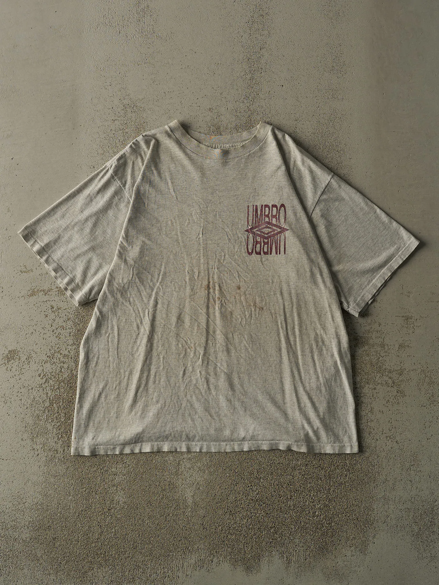 Vintage 90s Heather Grey Umbro Logo Single Stitch Tee (L/XL) sold by Rebalance Vintage