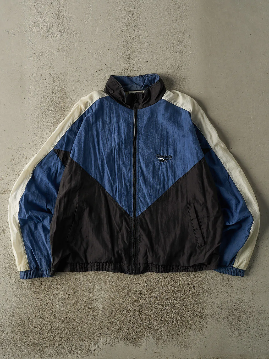 Vintage 90s Blue Black & White Reebok Track Jacket (L/XL) sold by Rebalance Vintage