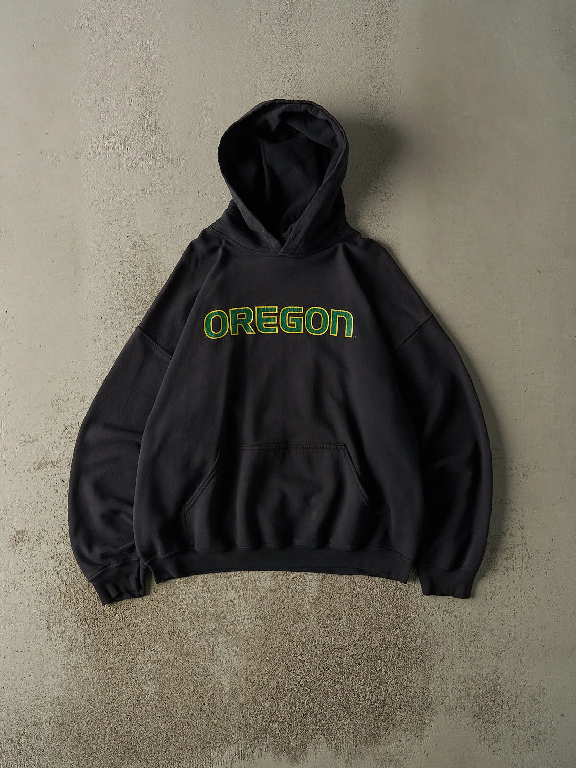 Vintage 90s Sun Faded Black University of Oregon Hoodie (L/XL) sold by Rebalance Vintage