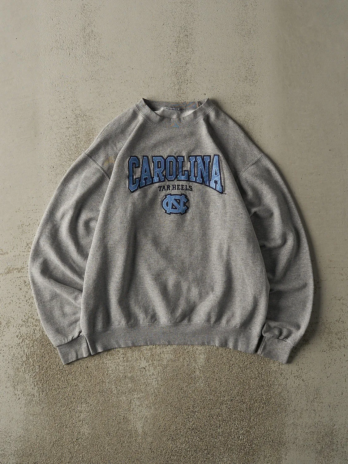 Vintage 90s Grey University of North Carolina Tar Heels Embroidered Crewneck (M/L) sold by Rebalance Vintage