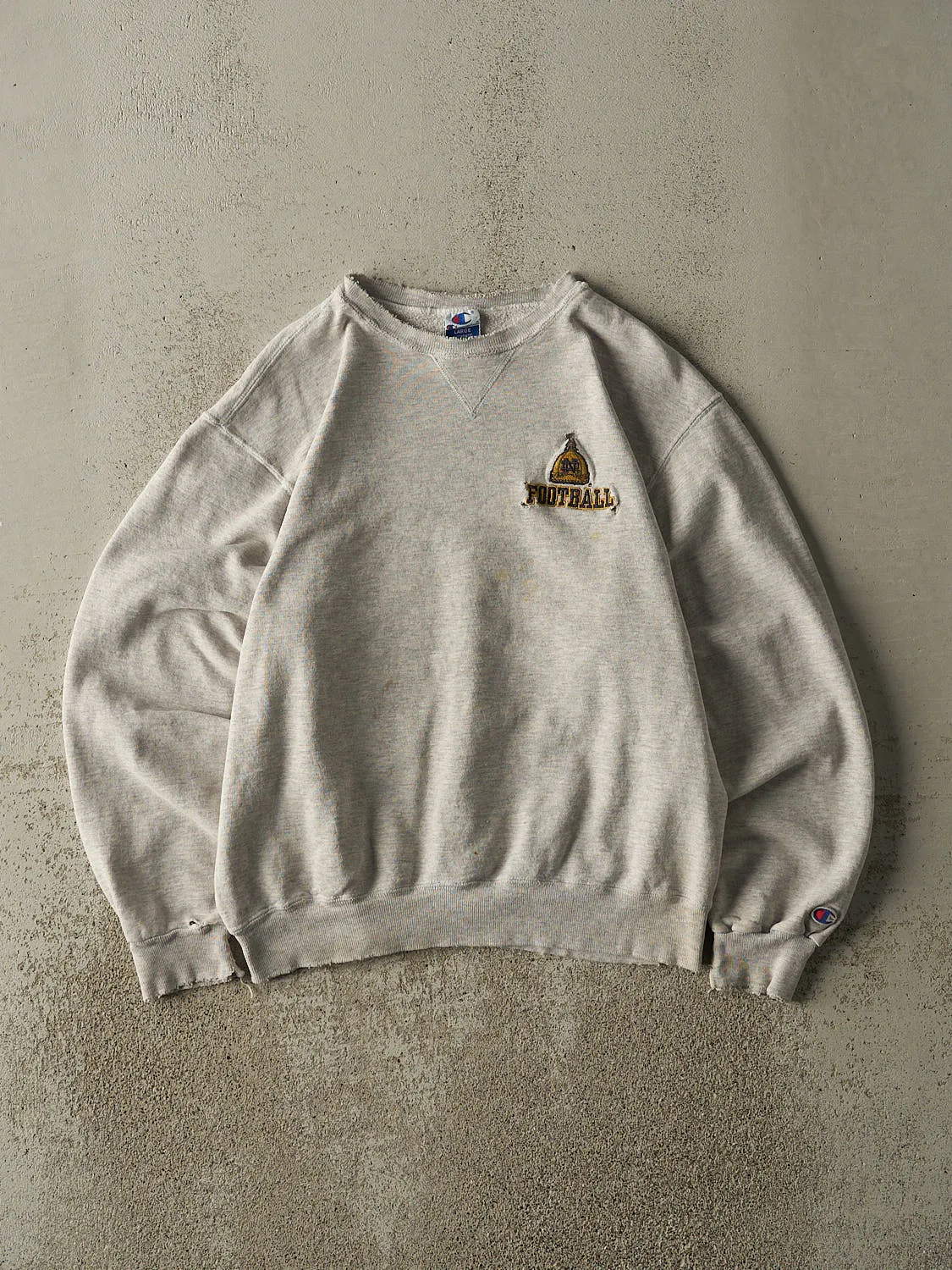 Vintage 90s Heather Grey University of Notre Dame Football Embroidered Crewneck (M) sold by Rebalance Vintage
