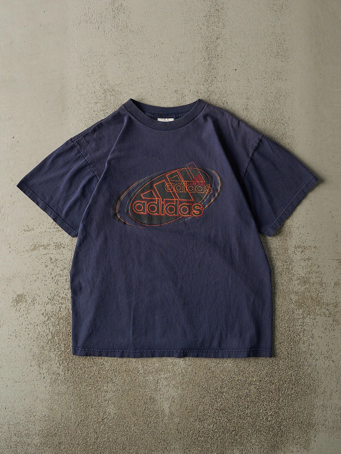 Vintage 90s Navy Blue Adidas Logo Tee (M/L) sold by Rebalance Vintage