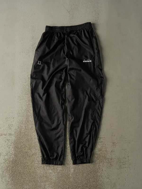 Vintage 90s Black Diadora Embroidered Track Pants (26x30) sold by Rebalance Vintage