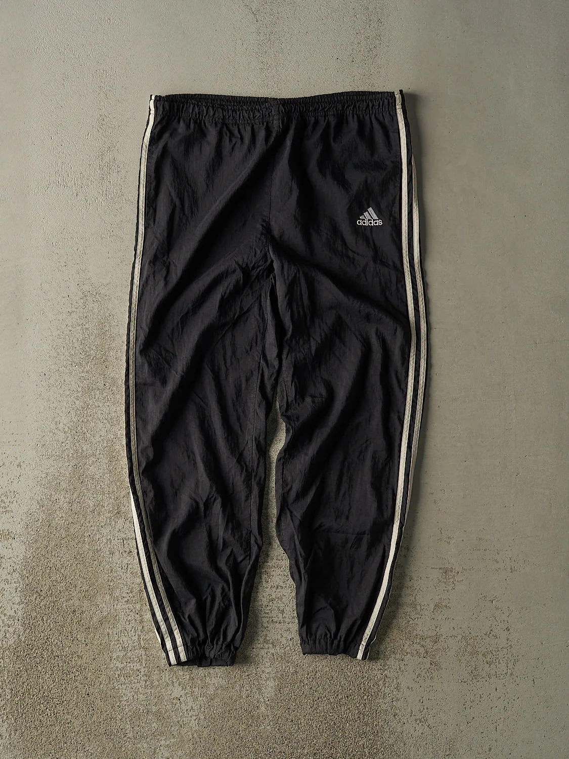 Vintage 90s Black Adidas Striped Track Pants (34x27) sold by Rebalance Vintage