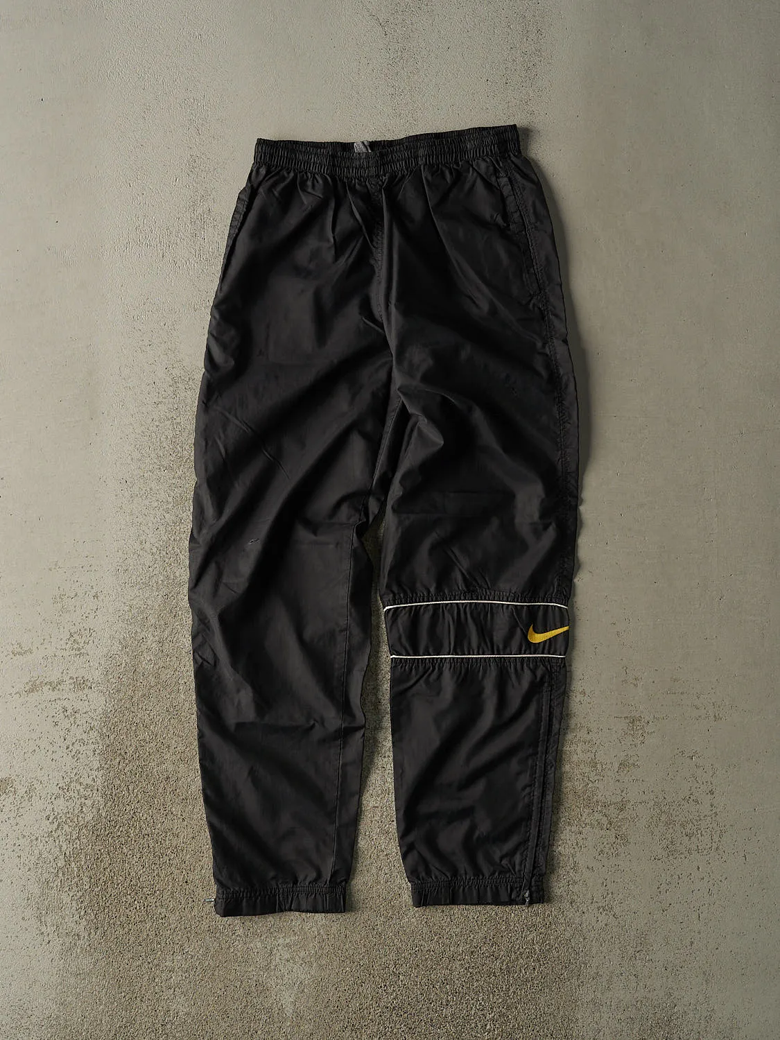 Vintage 90s Black Nike Embroidered Logo Track Pants (28x31) sold by Rebalance Vintage