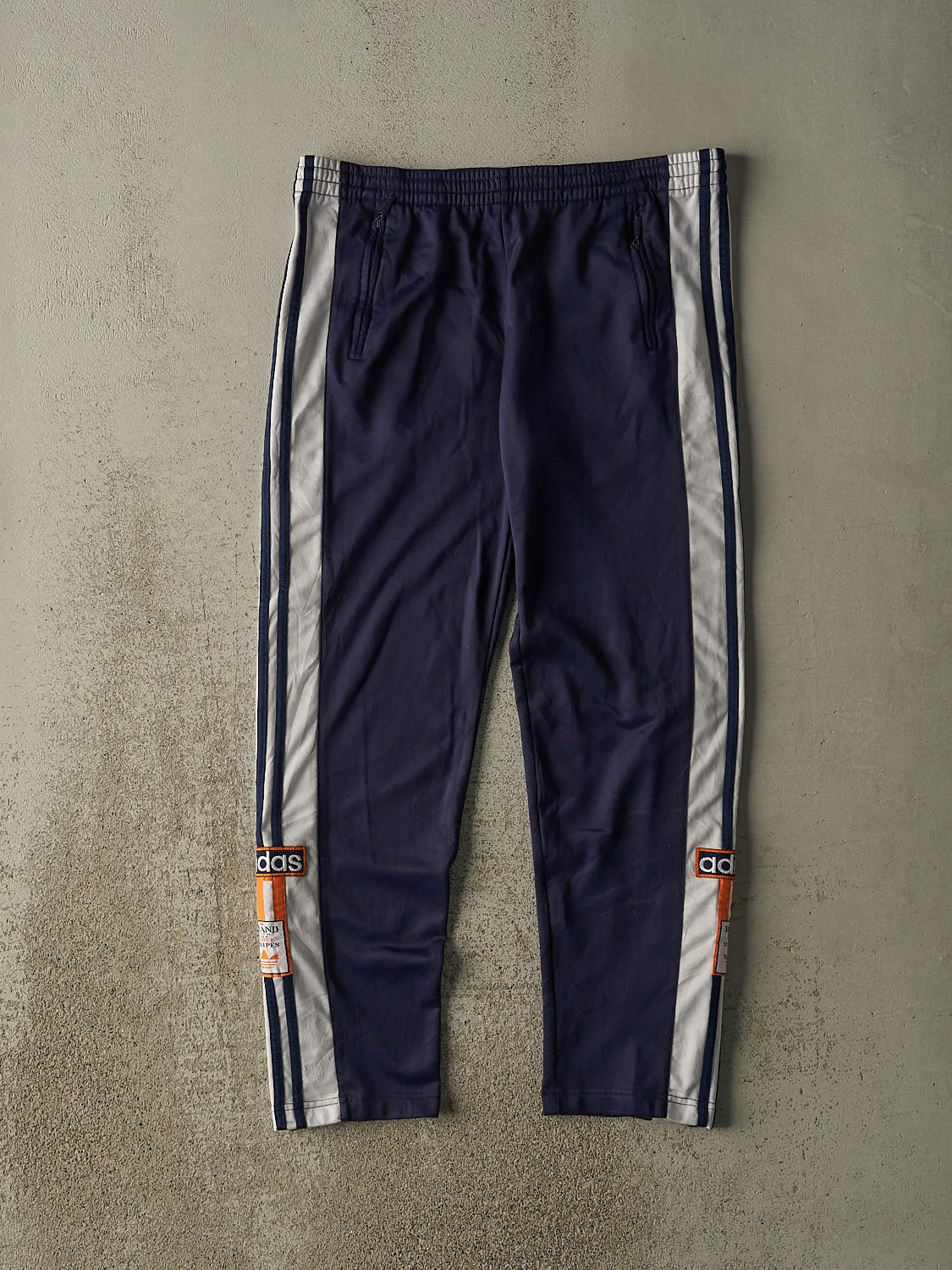 Vintage 90s Navy Blue Adidas Embroidered Striped Tear Away Track Pants (36x30) sold by Rebalance Vintage