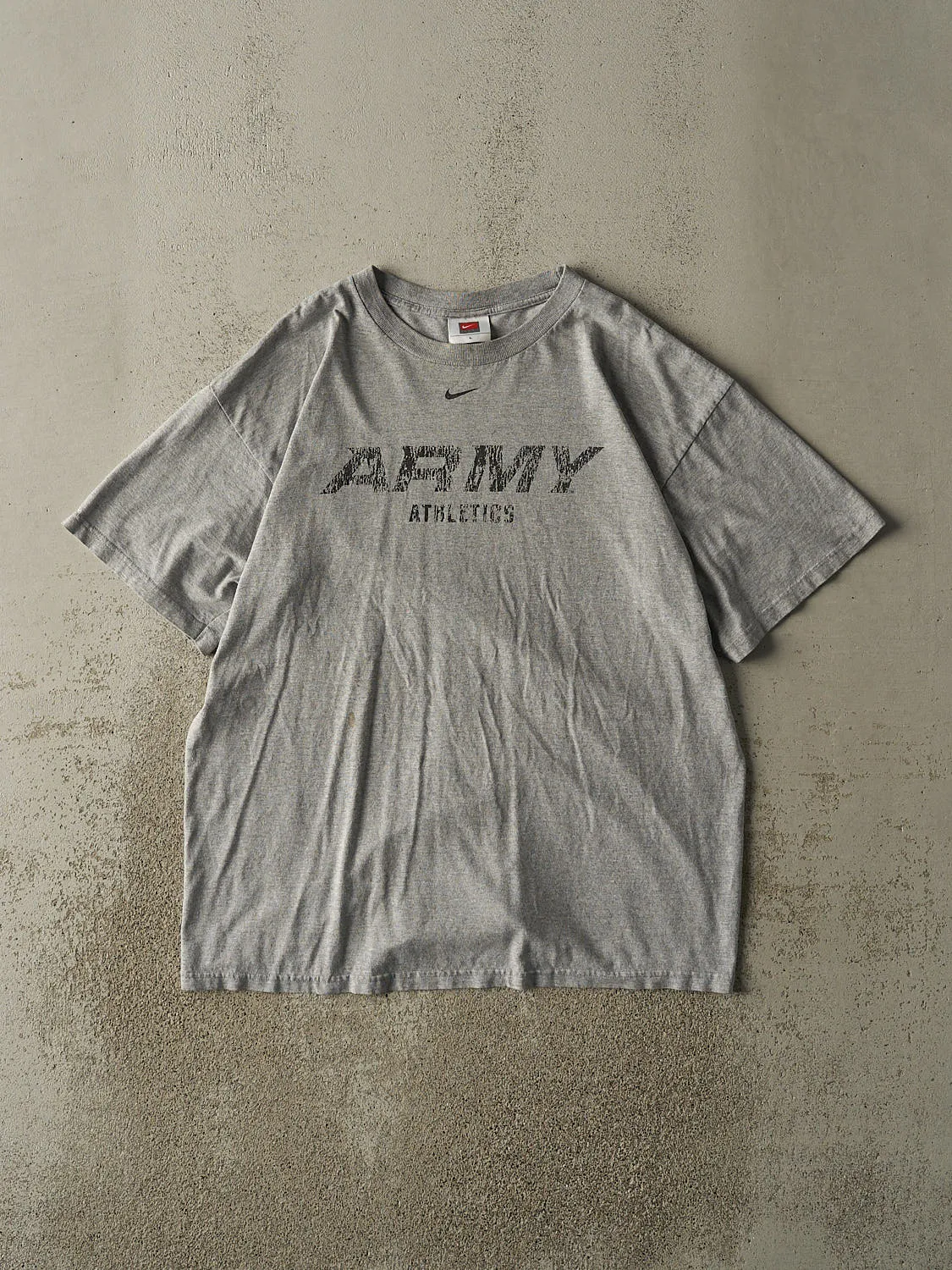 Vintage Y2K Grey Army Athletics x Nike Tee (L) sold by Rebalance Vintage