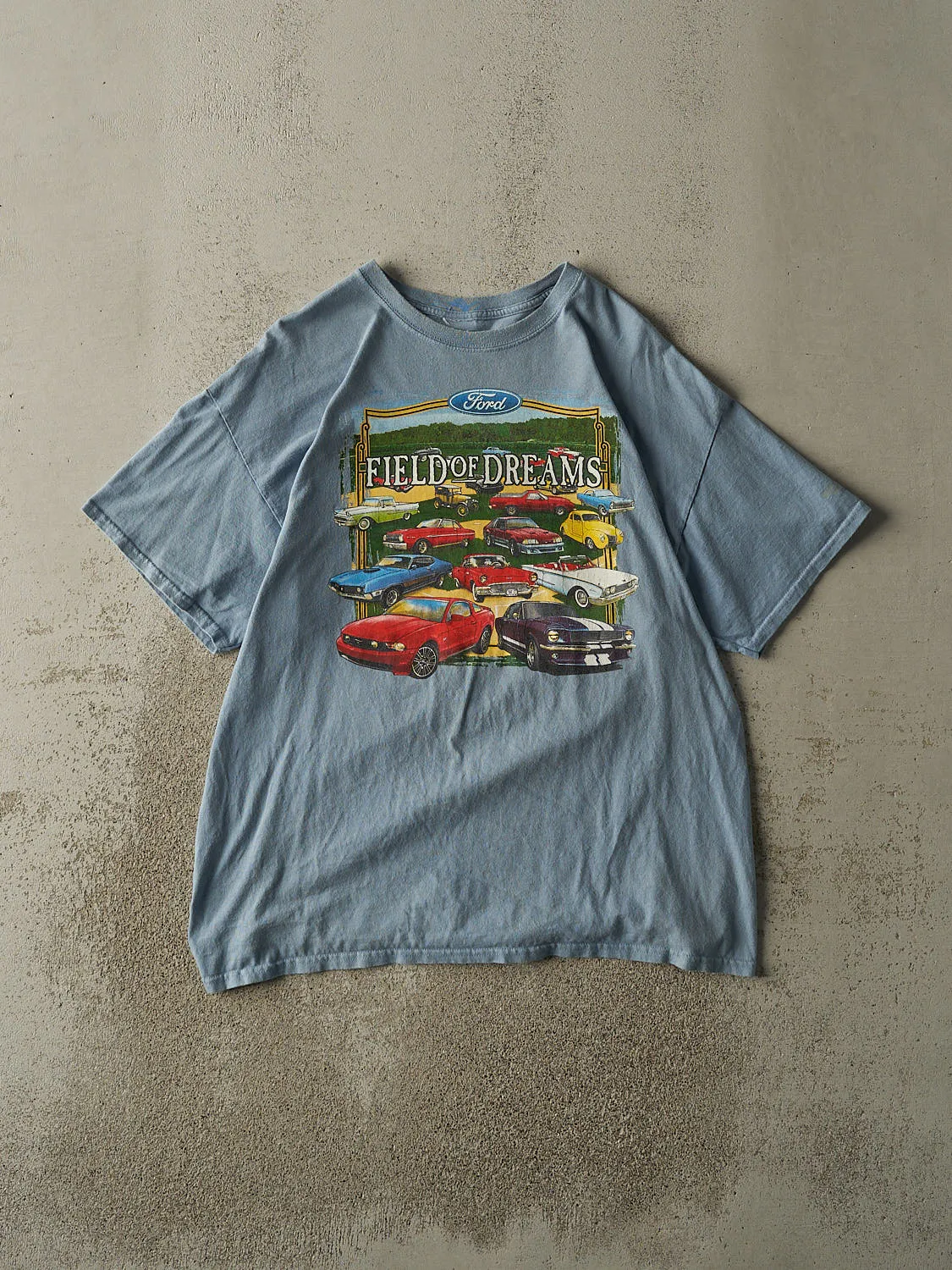 Vintage Y2K Slate Blue Ford Field of Dreams Tee (L) sold by Rebalance Vintage